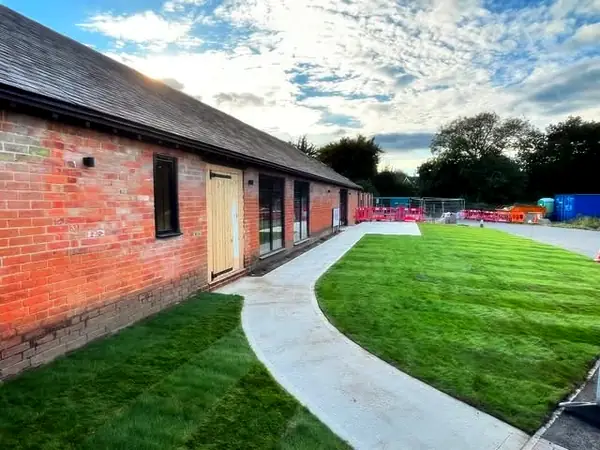 New path and lawn beside the finished building